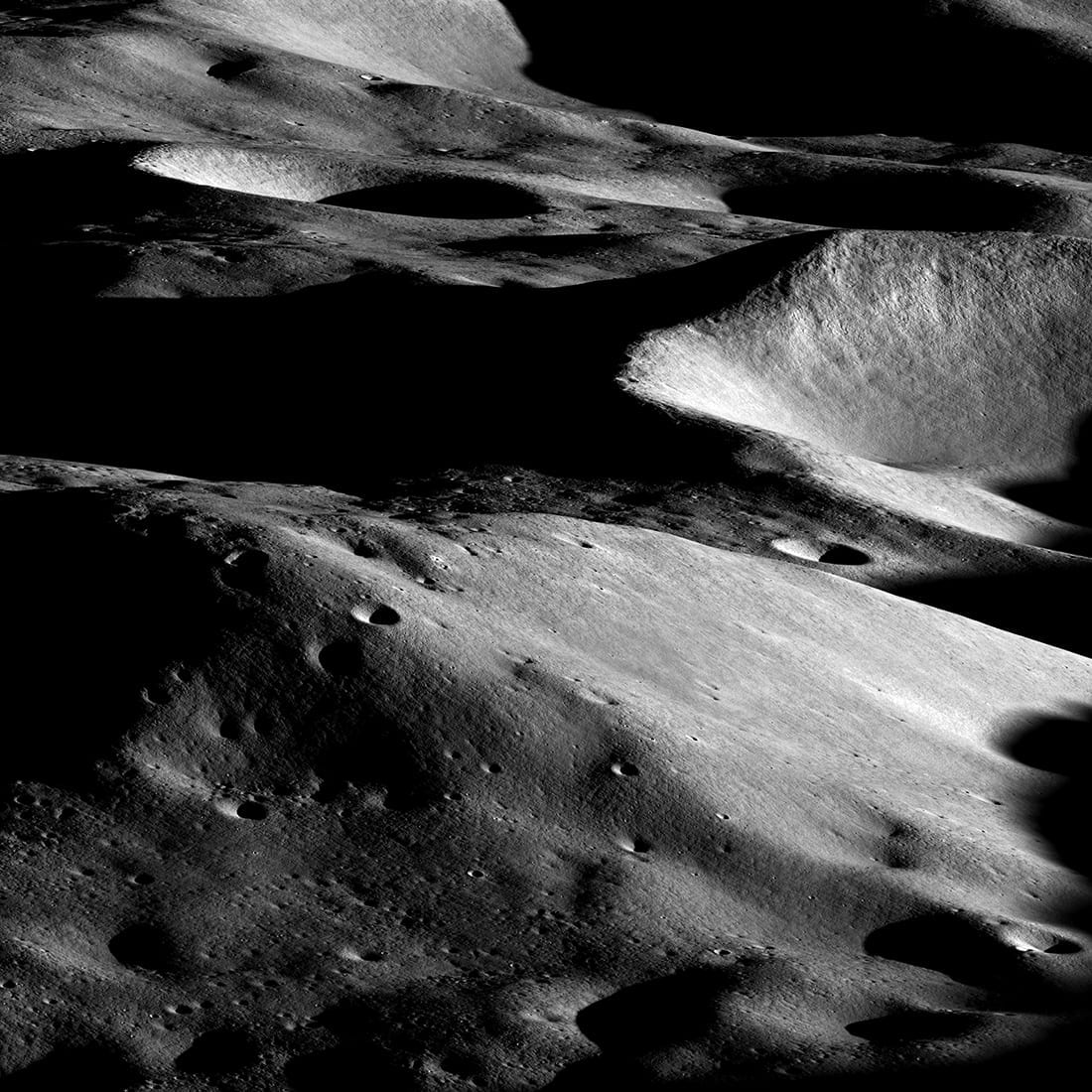 The Moon’s south polar region imaged from orbit, showing shadowed crater floors and sunlit ridges