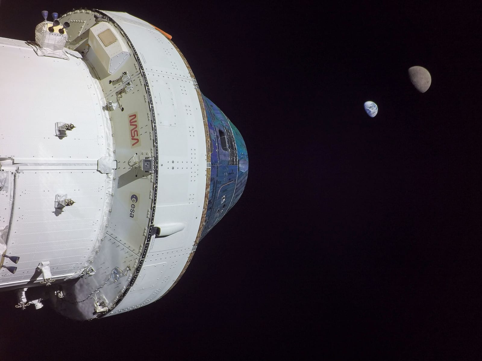 NASA’s Orion spacecraft in space with the Moon and Earth in the distance